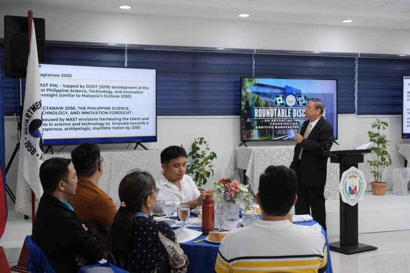 NAST PHL additive manufacturing roundtable at DOST, with a speaker at the podium and the Pagtanaw 2050 foresight slide on screen