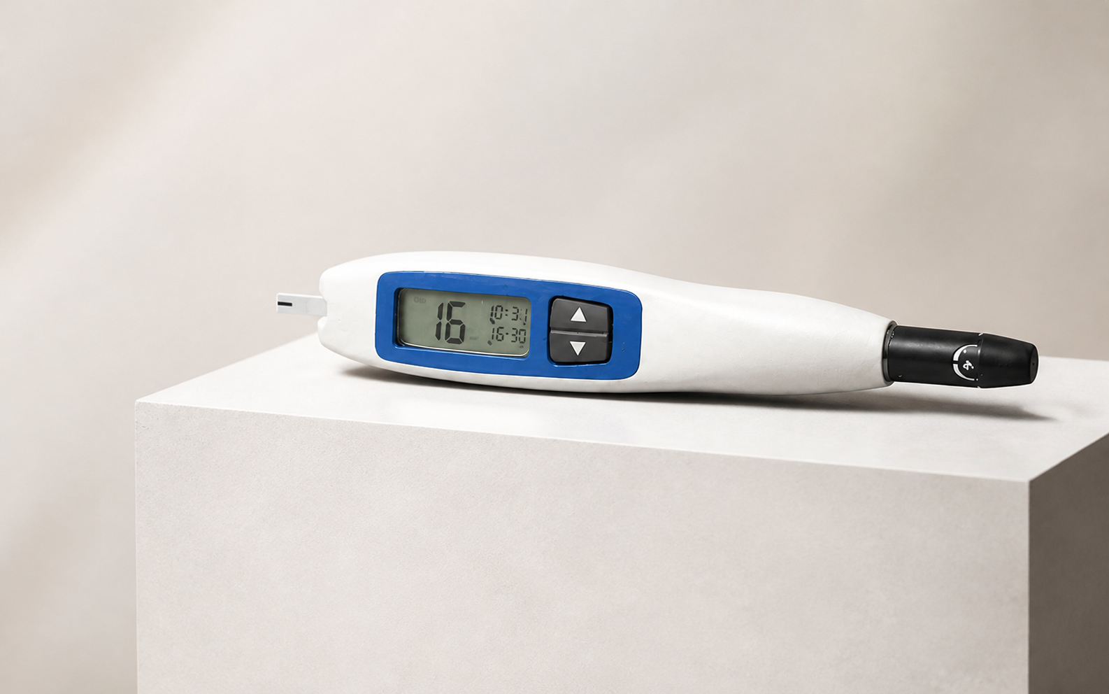 All-in-One Glucometer prototype presented on a warm white plinth